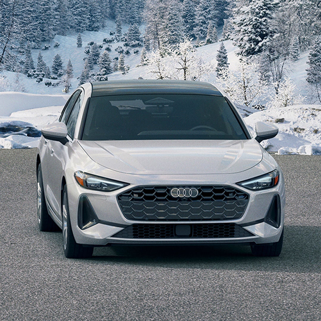 Front profile view of an Audi A5 parked.